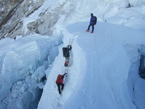 Ladder climbing in the Khumbu Icefall.
