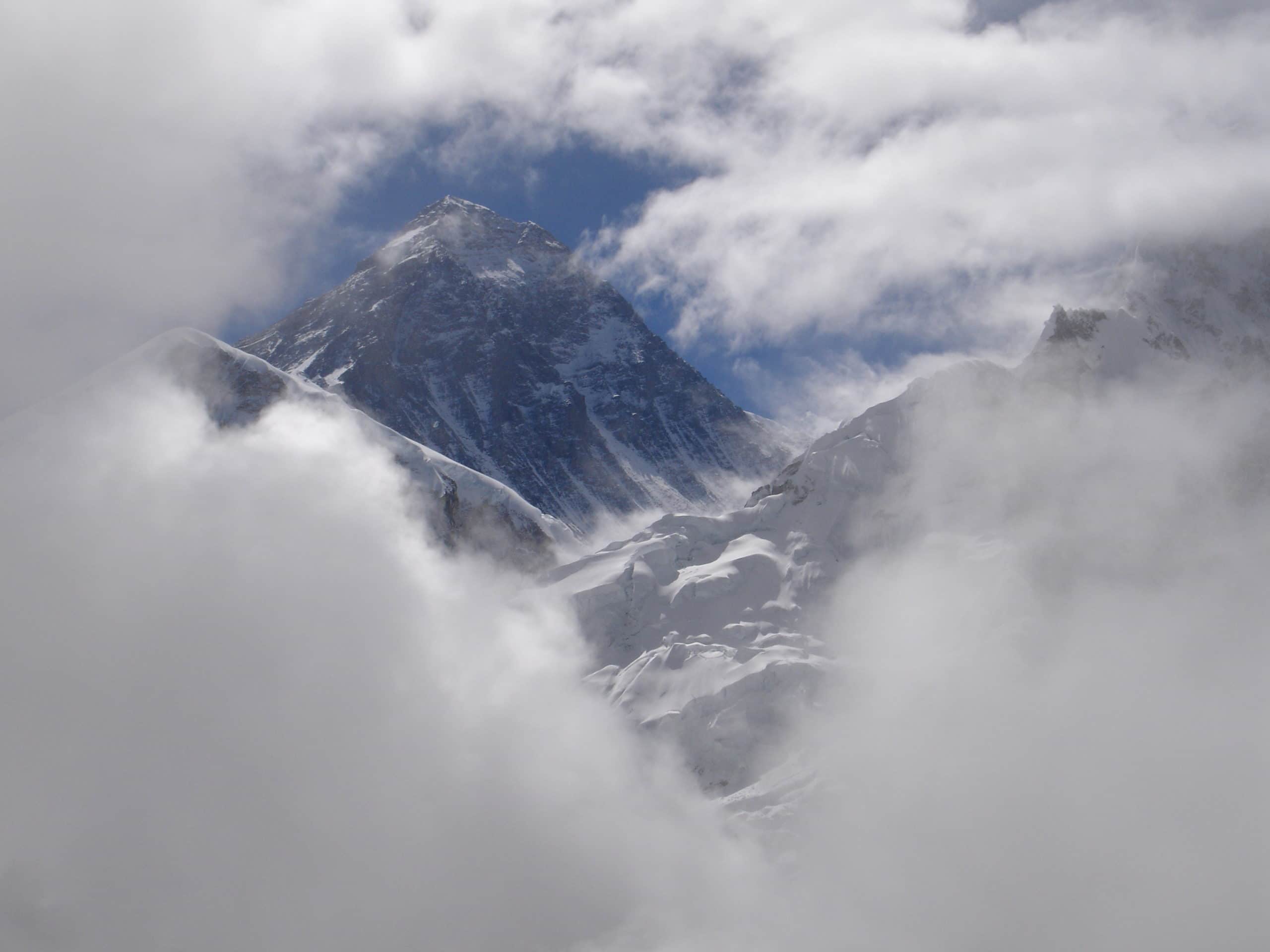 Everest showing up behind the clouds
