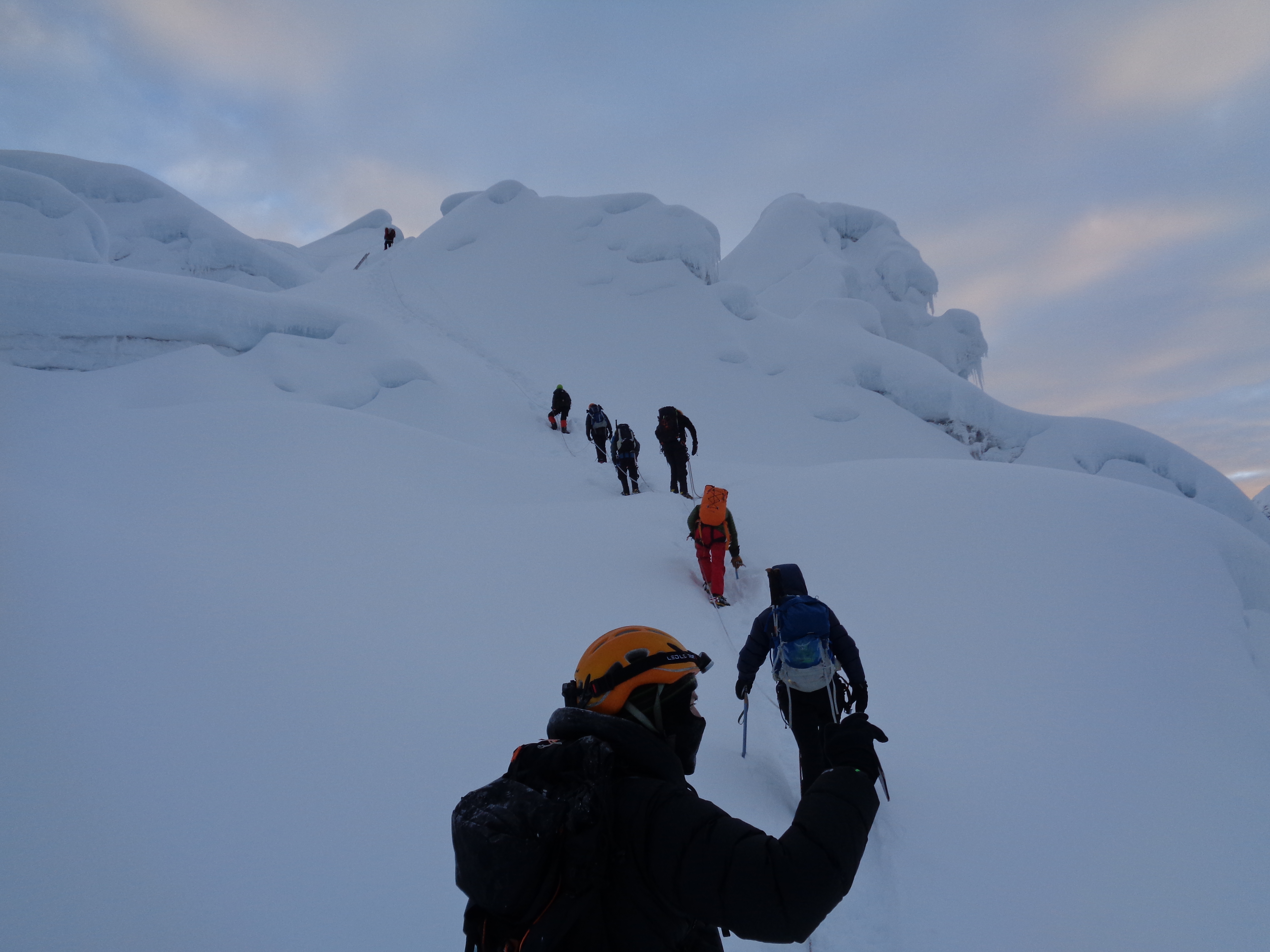 As the sun comes up on Island peak, making our way through the glacier.